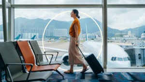 Illustration of woman walking through airport