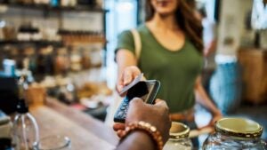 Cashier helping a customer pay in a grocery store